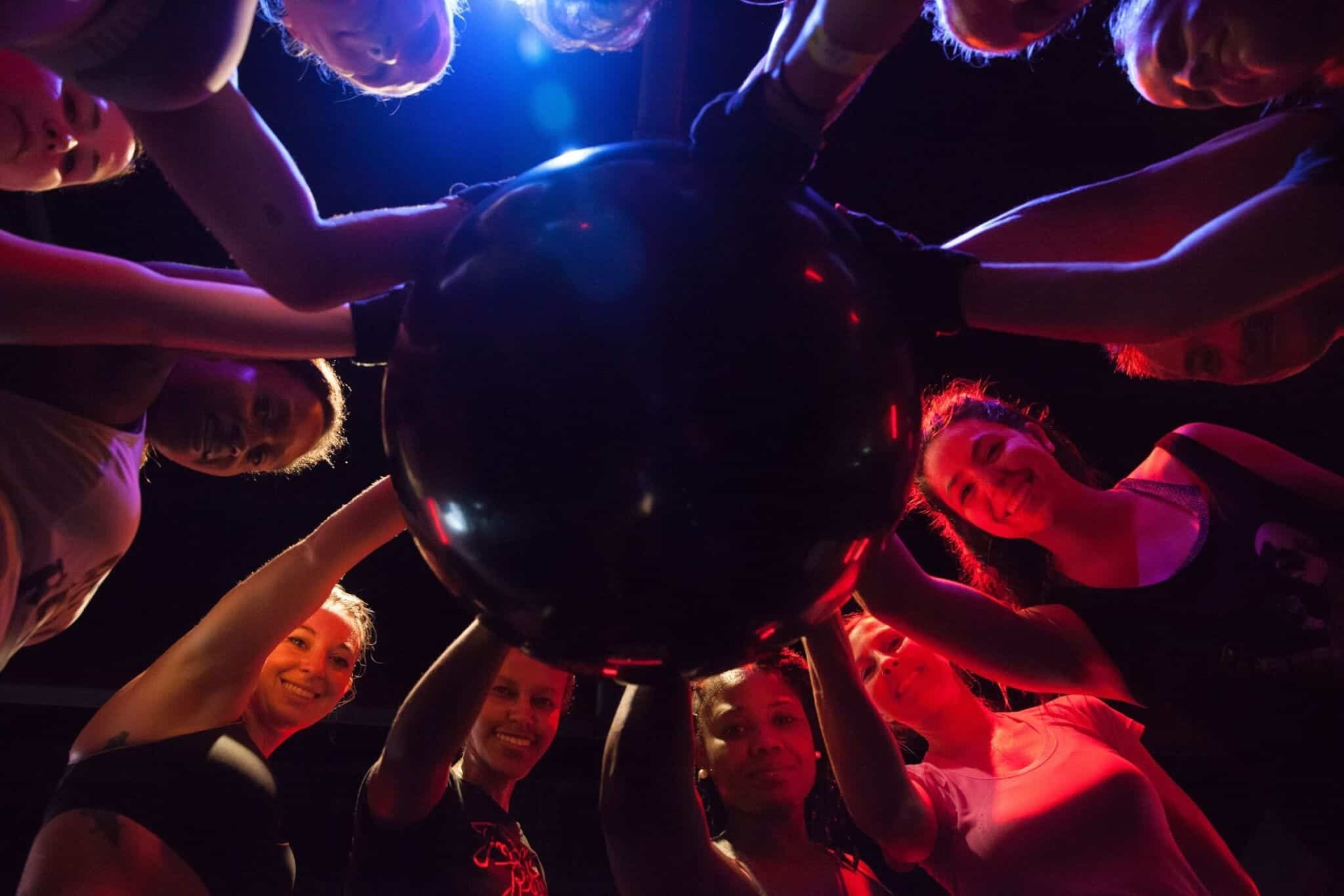 A full class training on the teardrop bags in the Buckhead studio under red light.
